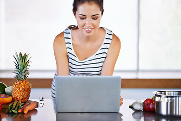 Image showing Woman, thinking and laptop on kitchen counter, happy female person and home on internet. Google it, browsing cooking recipes and social media, online search on technology for healthy food ideas