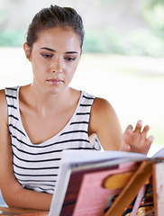 Image showing Cooking, reading and kitchen with woman, book and supper with recipe and ingredients with nutrition and vegetarian. Home, girl or person with skills and healthy meal with diet plan, wellness or lunch