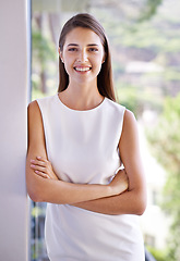 Image showing Portrait, happy and business woman arms crossed at hotel in morning for hospitality or accommodation. Smile, company and trip with confident young employee at apartment or lodge for professional trip