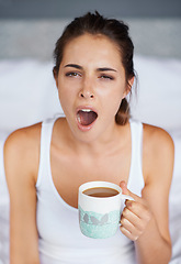 Image showing Woman, tired and yawning with tea in bed, waking up from sleeping or nap with morning routine at home. Insomnia, fatigue and sleepy in bedroom, warm drink or beverage for breakfast and start day