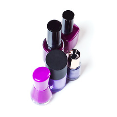 Image showing Nail polish, color and purple paint on a white background for beauty, cosmetics and salon products. Cosmetology, luxury spa and isolated bottles for nails manicure, pedicure and pamper in studio