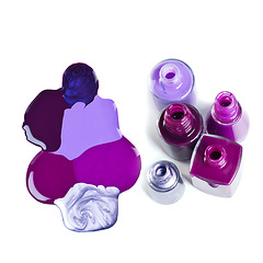 Image showing Nail, polish or bottle to spill in beauty, cosmetology or product art as luxury, manicure or pedicure. Creative aesthetic, cosmetic or color paint pattern as liquid drip effect on white background