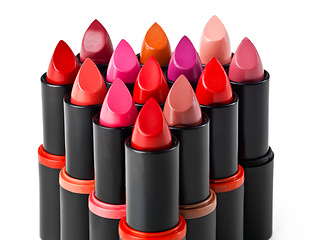 Image showing Lipstick, makeup and product in studio for cosmetics, beauty and luxury colors on white background. Closeup, aesthetic and dermatology for lip grooming, choice and group for selection in promo or ads