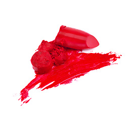 Image showing Smeared, studio and isolated red lipstick, makeup and cosmetics on white background. Trendy, bright colour for creative beauty with artistic pieces with texture smudged in beautiful vibrant product