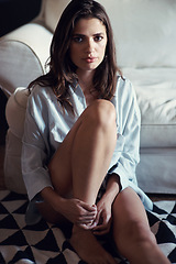 Image showing Fashion, portrait and woman in home on sofa with confidence and pride for casual clothes. Girl, relax and sitting on floor by couch in house with style in living room on holiday, break or vacation