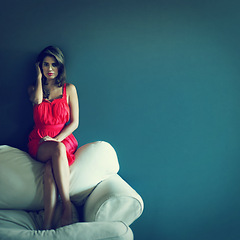 Image showing Fashion, portrait and woman in home on sofa with confidence and pride for clothes mockup. Girl, relax and sitting on couch in house with vintage or retro style in living room with space on wall
