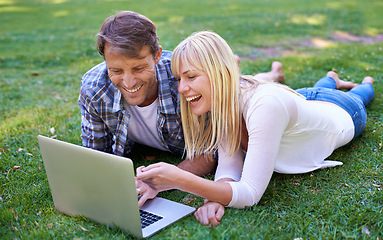 Image showing Love, laugh or couple with laptop in nature for social media, video or streaming comic outdoor Computer, google it or people in backyard online for show search, sign up or netflix and chill on grass