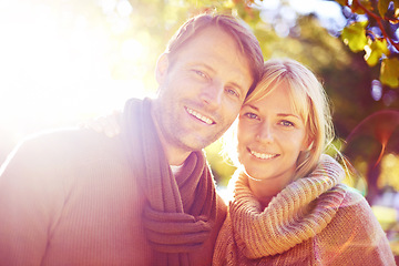 Image showing Portrait, hug and sunshine with couple in a park, nature and love with marriage and happiness. Face, embrace or man with woman or lens flare with vacation for anniversary or summer with weekend break