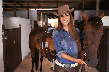 Image showing Woman or cowgirl, portrait and horse in barn to train or feed and grooming for animal or pet care. Person, stallion and stable to ride together in countryside in Texas for rural life and adventure.