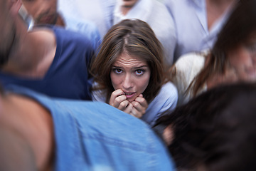 Image showing Woman, crowd and trapped with social anxiety at work with stress, scared and overthinking with concern. Female person, coworkers and people with worry, nervous and stuck at office as introvert