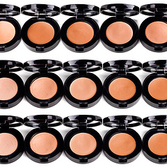 Image showing Foundation, powder and makeup product for beauty with texture in container, studio and white background. Aesthetic, transformation and choice of shades or colour for application of cosmetics pallet