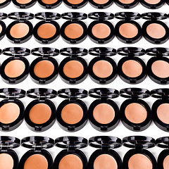 Image showing Beauty, application and makeup product of cosmetics with texture in container, studio and white background. Aesthetic, transformation and choice of shades or colour for powder of foundation pallet