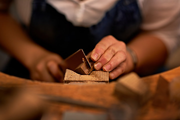 Image showing Woodworking, artisan and hands of person in workshop for creative project or sculpture. Craft, industrial and closeup of carpenter manufacturing products with tools in studio for small business