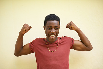 Image showing African, portrait and teenager with smile, flex and happiness for youth and cool. Student, strong and positive with macho, identity and inspirational or motivation on wall background outdoors