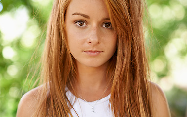 Image showing Girl, teenager and portrait in outdoor or garden for comfort, clean and hygiene for natural skin, hair and face. Young person and teen with ginger and freckles for clear and healthy for wellness