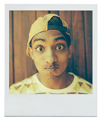 Image showing Portrait, funny face and teenager in home with picture at apartment with wood background in India. Cap, goofy and silly young boy with a hat in house with comic facial expression for photo on mockup