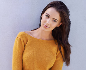 Image showing Portrait, fashion and serious young woman or model in an outfit isolated on a purple wall background. Face, trendy and confident female person in casual clothes, apparel or stylish sweater in Italy