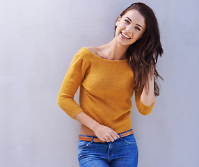 Image showing Portrait, fashion and smile of woman on a wall, model or funny girl laughing isolated on a white background mockup space. Happy, trendy an person in casual clothes, jeans or stylish sweater in Italy