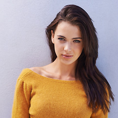 Image showing Portrait, fashion and confidence of woman on a wall, model or girl isolated on a purple background. Face, serious and beauty of young person in casual clothes, trendy and stylish sweater in Italy