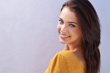 Image showing Portrait, fashion and happy woman on a wall, beauty or girl isolated on a purple background mockup space. Face, skin and smile of young person in casual clothes, trendy and stylish sweater in Italy