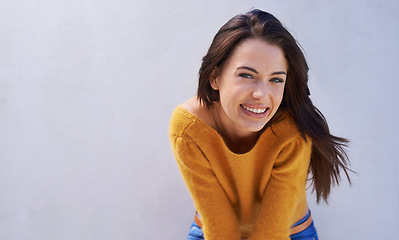 Image showing Portrait, fashion and smile of woman on a wall, model or girl isolated on a purple background mockup space. Face, beauty and happy person in casual clothes for trendy style in cool sweater in Italy