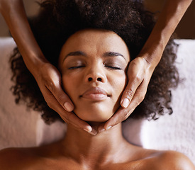 Image showing Woman, spa and massage hands on face with towel, facial and treatment for wellness and care. Skincare, relax and calm African female person with skin glow and natural beauty at hotel or resort