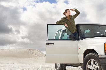 Image showing Car, road trip and woman in a desert for location, search or holiday, adventure and exploration. Travel, stop and female person with vehicle in Egypt for sand dunes journey, nature or waiting outdoor