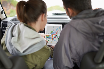 Image showing Couple, car and gps on road trip with map for direction, vacation and travel to destination in countryside. Woman, man and tablet in vehicle for navigation and location to holiday journey and tourism