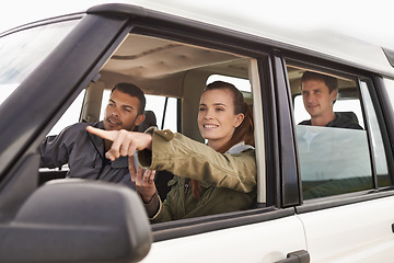 Image showing Friends, car and pointing on road trip with travel for adventure, vacation and sightseeing with happiness in countryside. Woman, men and driving in vehicle for holiday journey, tourism and scenery