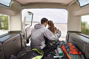 Image showing Couple, road trip and car hug for adventure, travel or transport in nature for vacation. Love, affection and motor vehicle for outdoor holiday or honeymoon or explore in dunes for rural getaway
