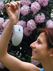 Image showing Young girl holding computer mouse