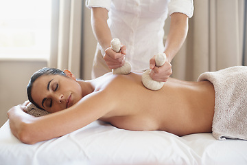 Image showing Relax, herbal compress and massage of woman at spa for skincare, peace or calm at luxury resort. Beauty, therapy and masseuse with bag at salon for body treatment, health and hands of person on back