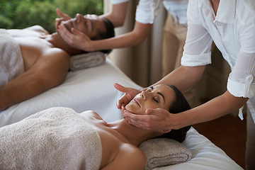 Image showing Vacation, facial massage and couple relax in spa for care of body with rest on table of retreat for honeymoon. Hotel, man and woman together in resort for health, wellness and holiday for skincare