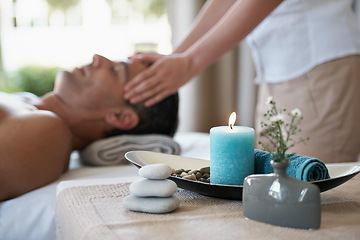 Image showing Luxury, facial massage and man relax in spa with aromatherapy candle for holistic treatment. Hotel, peace and health for male person, wellness and rest in resort for holiday for skincare in break