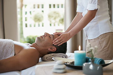 Image showing Relax, head massage and man at spa for skincare, peace and calm at luxury resort at table for wellness. Beauty, therapy and person at salon for face treatment, health and hands of masseuse pampering