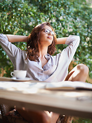 Image showing Cup, thinking and woman at coffee shop, cafe and restaurant to relax for tea, cappuccino and espresso on break. Gen z girl, female person and lady with vision, idea and book for reading outdoor