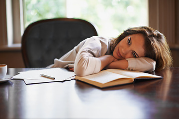 Image showing Tired, woman and portrait of studying on table with research, notes and paper in library at college. Student, relax and rest on desk with writing, project or fatigue from burnout at university