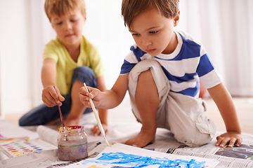 Image showing Creative, boys and painting in playroom for child development, art project or homework together. Little friends, brush and drawing on paper for learning, education and bonding activity in home