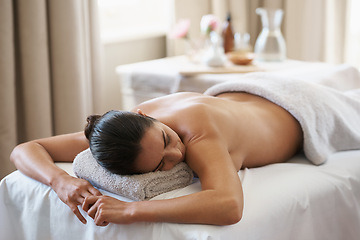 Image showing Relax, massage and woman at spa for skincare, peace and calm at luxury resort. Beauty, therapy and person at salon for body treatment, health and resting at table for service to pamper for wellness