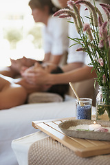 Image showing Salt, flowers or couple in spa to relax on bed or break with luxury pamper treatment tools or candles. Flamingo feather celosia, facial or people at resort for natural healing benefits or massage