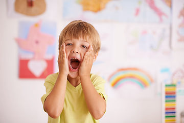 Image showing Excited, scream and portrait of kid in kindergarten for learning, knowledge and development in classroom. Child, education and hand on face for surprise, shock and happiness for school achievement