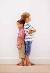 Image showing Boy, children or back to ignore, angry or conflict as bad emotional mistake in worry or frustration. Kids, friends or frustrated in fight, problem or argument for moody tantrum, behavior or attitude