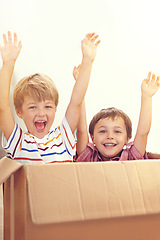 Image showing Box, children or portrait of siblings playing in house for fun, bonding or hands up game. Cardboard, learning and excited kids in living room for celebration, imagine or rollercoaster fantasy at home