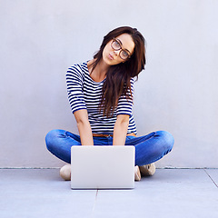 Image showing Portrait, woman and relax on floor with laptop for remote work or freelancing, web browsing and research for idea or project. Female person, casual and computer for internet, social media and blog.