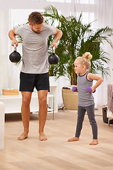 Image showing Man, girl child and weightlifting for fitness, father and daughter spending time together for love in living room. Dumbbells, kettlebell and muscle training with exercise and bonding at family home