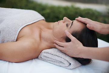 Image showing Spa, woman and hands with massage for relax at resort, luxury hotel and vacation for wellness and therapeutic pamper. People, masseuse and body care with facial treatment, hospitality and zen outdoor