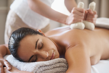 Image showing Relax, herbal compress and massage of woman at spa for skincare, peace or calm at luxury resort. Beauty, therapy and masseuse with bag at salon for body treatment, health or hands of person on back