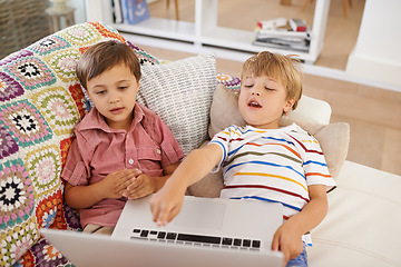 Image showing Laptop, kids and siblings on sofa for cartoon, film or streaming movie at home. Computer, learning or boy children in house for google it, search or hand pointing to video, show or Netflix and chill