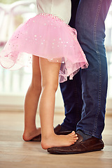 Image showing Legs, feet with father and daughter dance, teaching and learn with music and rhythm at family home. Man, young girl and standing together with activity for bonding, ballet with safety and support