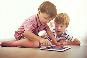 Image showing Siblings, children and tablet on a floor with cartoon, gaming or streaming movie at home. Digital, learning and boy kids in house for google it, search or ebook storytelling, app or netflix and chill